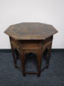 An octagonal carved Eastern occasional table CONDITION REPORT: Height 60cm,