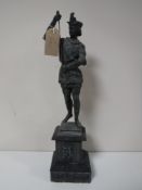 A spelter figure on slate stand together with eleven table lighters in the form of tankards,
