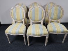 A set of six contemporary balloon back dining chairs in a washed pine finish
