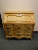 A continental light oak bureau,