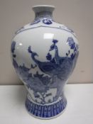 A Chinese blue and white vase, with bird decoration,