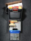 A box of Black & Decker sander, tile cutter, tap and die set,