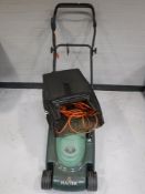 A Hayter Envoy 36 electric lawn mower with grass box and lead