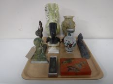 A tray containing carved soap stone vases, religious figure,