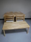 A contemporary pine kitchen table with four chairs,