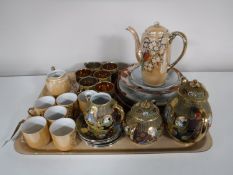 A tray containing a Japanese tea sets and tea plates