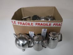 A box containing stainless steel tea services plated spirit kettle