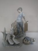 A Lladro figure, duck with chicks,