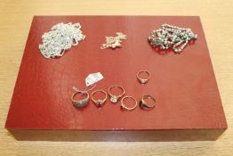 A jewellery box containing a group of 9ct gold and other dress rings and three costume necklaces
