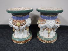 A pair of circular pottery elephant plant stands