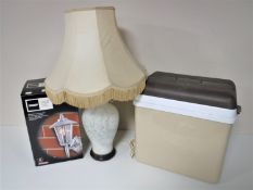 A cool box together with an outdoor lantern,