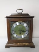 A Seth Thomas brass faced mantel clock