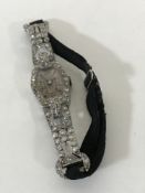 Superb quality Lady's platinum cocktail watch set with approximately 2.