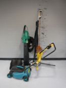 A Dobbies electric lawn mower with lead and box,