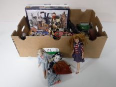 A box containing mid twentieth century toys including oversized plastic soldiers, dolls,