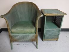 A green Lloyd Loom Lusty chair with matching bedside stand