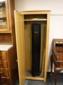 A fortify three section shotgun cabinet with keys,