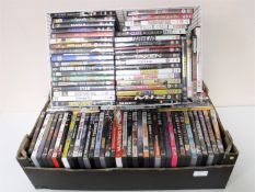 A basket and a box of assorted DVDs