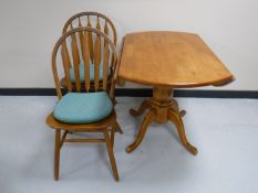 A contemporary pine drop leaf kitchen table,