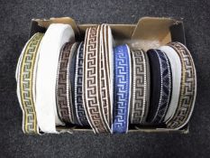 A box of nine spools of vintage Silver Cross pram trim