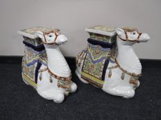 A pair of pottery camel plant stands