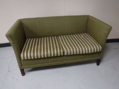 A mid twentieth century two seater settee upholstered in green striped fabric