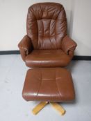 A brown leather swivel relaxer chair with matching stool
