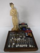 A tray containing a resin statue, shy maiden,