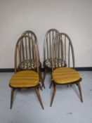 A set of four Ercol high backed dining chairs