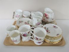A tray of three bone china tea services