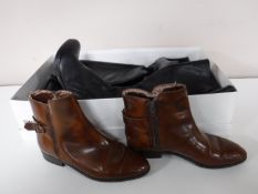 A box containing two pairs of lady's leather knee high boots,