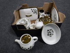 A box containing Denby Shamrock tea and dinnerware