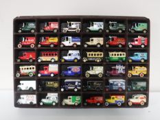 A display case containing thirty six die cast vehicle,
