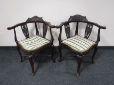 Two antique carved mahogany corner chairs