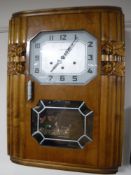 An oak cased French Vedette wall clock