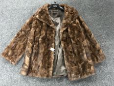 A dark brown vintage mink jacket