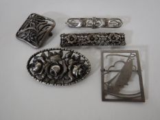 Five silver brooches