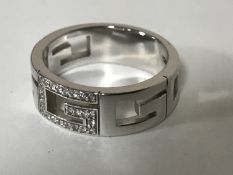 An 18ct gold diamond set ring by Gucci, 10.