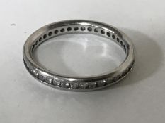 A platinum diamond eternity ring,