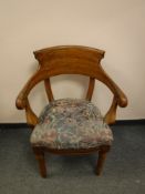 An antique oak armchair,