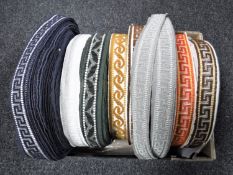 A box of nine spools of vintage Silver Cross pram trim