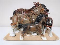 A tray containing four china shire horses
