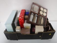 A box containing gift sets, perfumes, jewellery box, set of boxed photo frames,