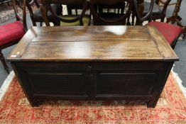A nineteenth century panelled oak coffer,