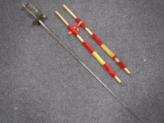 A brass handled fencing foil,
