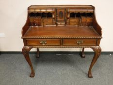 A Chippendale-style twin-drawer desk, width 109 cm.