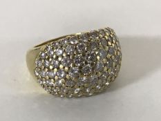 An 18ct gold large bombe diamond ring, set with 80 good quality diamonds, approximately 4ct.