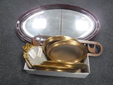 An oval mahogany framed mirror,