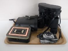 A tray containing two sets of cased binoculars, an Ilford camera,