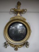 A Regency gilt and gesso convex girandole mirror with candle sconces CONDITION REPORT: